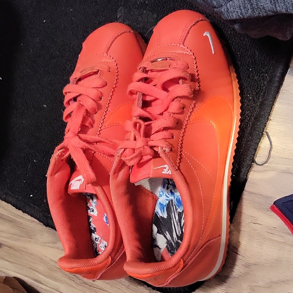 Orange size 7 Nike Cortezs